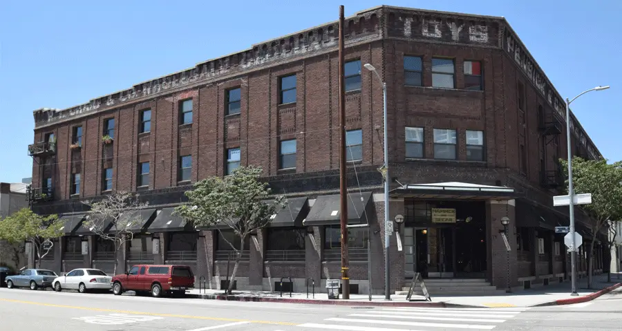 Corner view of the historic Toy Warehouse Lofts brick building in downtown Los Angeles