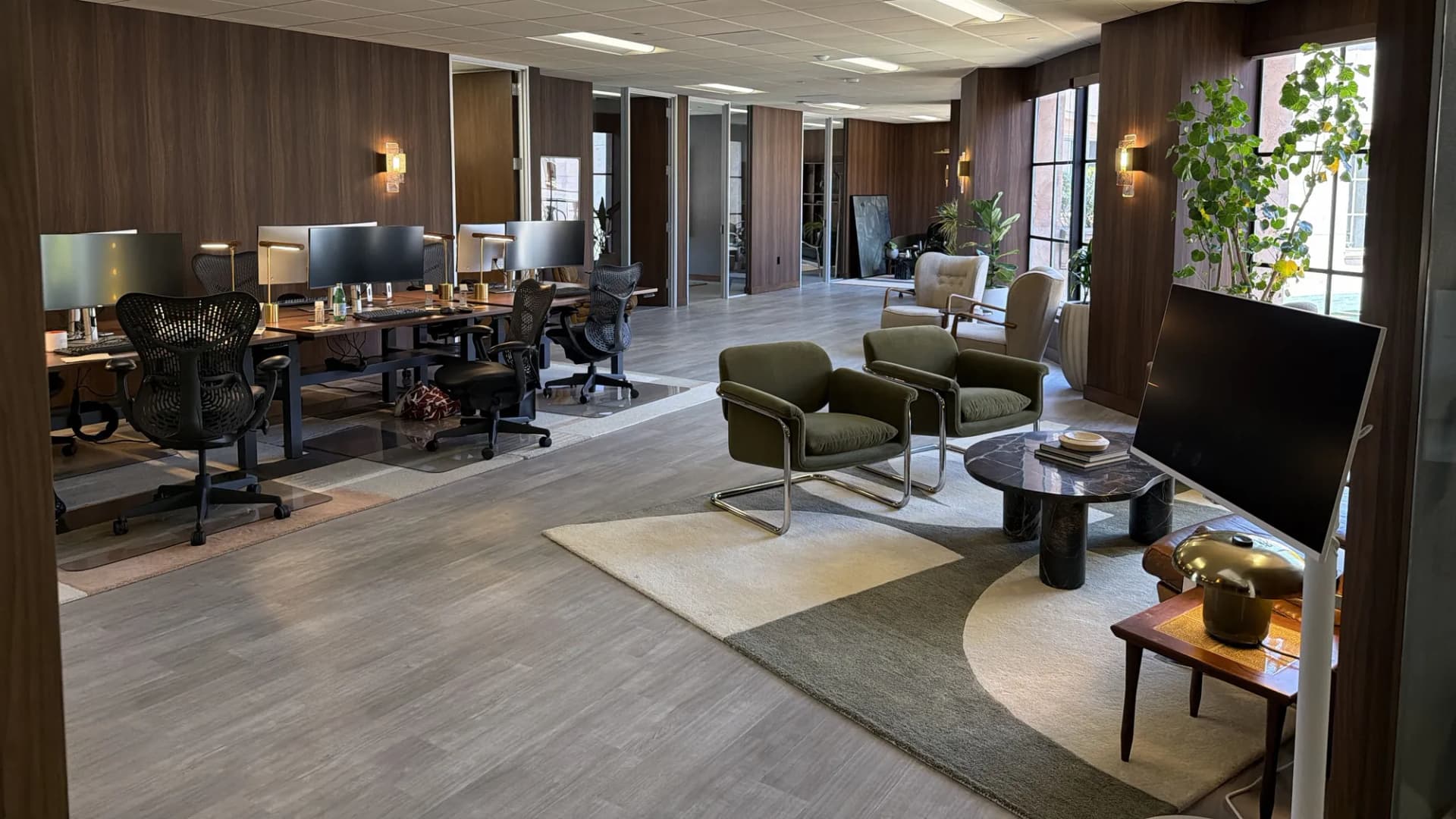 Finished open office with walnut wall panels and lounge seating