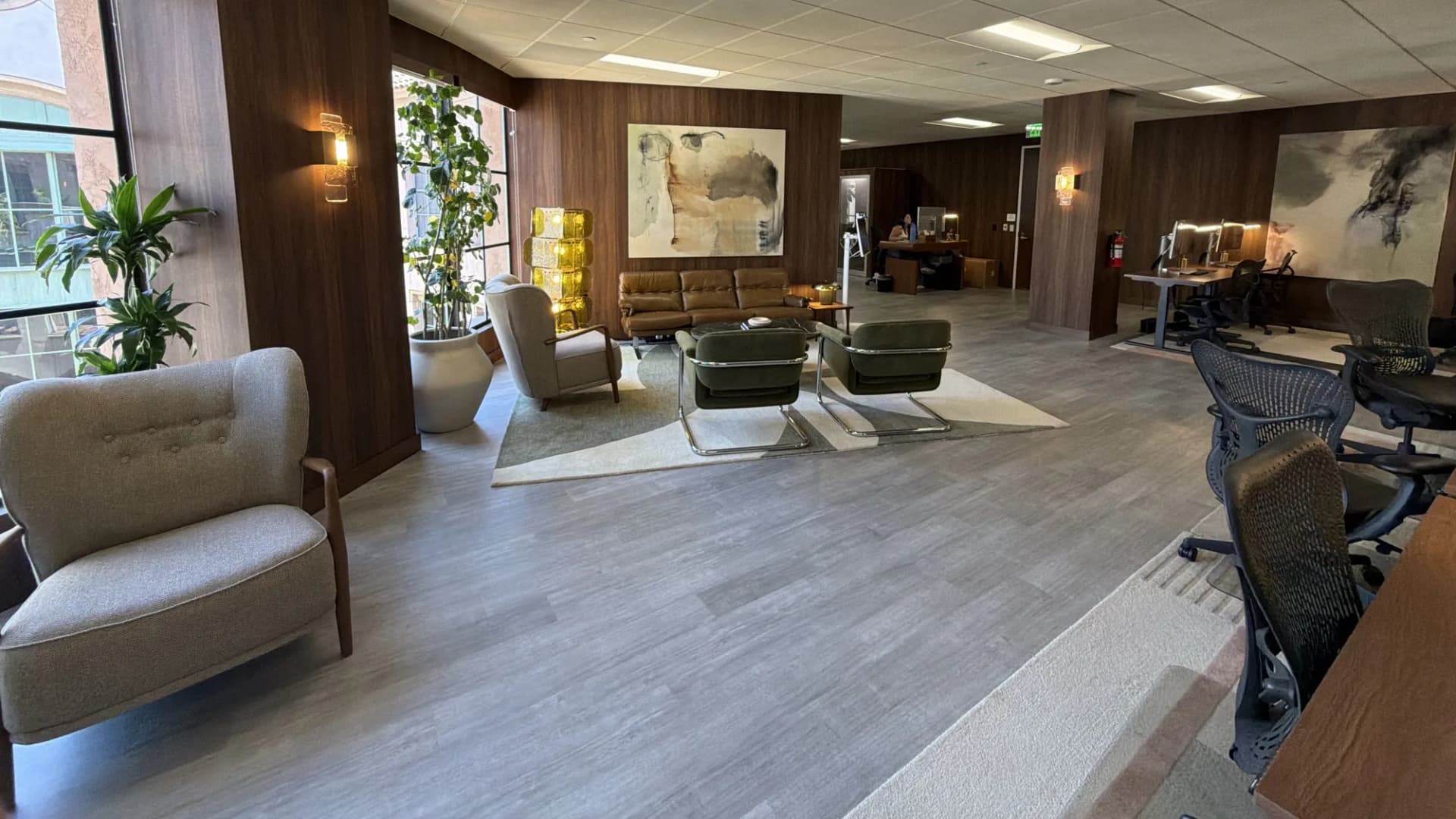 Lounge seating area within an open-plan executive office